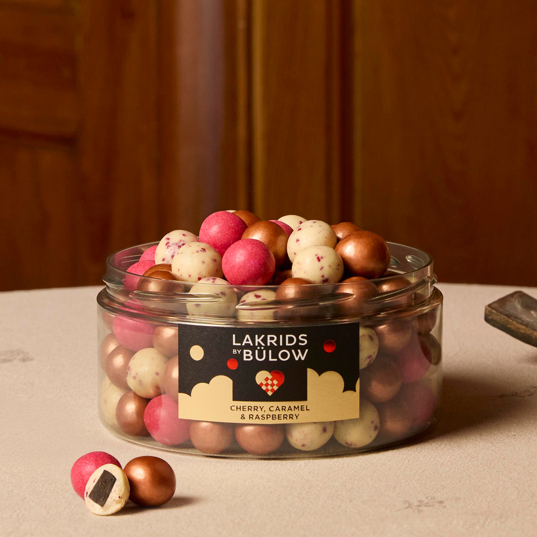 Lakrids Winter - Large Mixed Classic, Cherry Sour & Crispy Raspberry in a 515g jar. Open on a table.